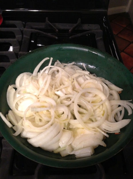 Onions in pan to sautee.