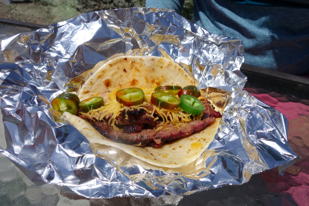 Brisket taco with jalapeno and cheese.