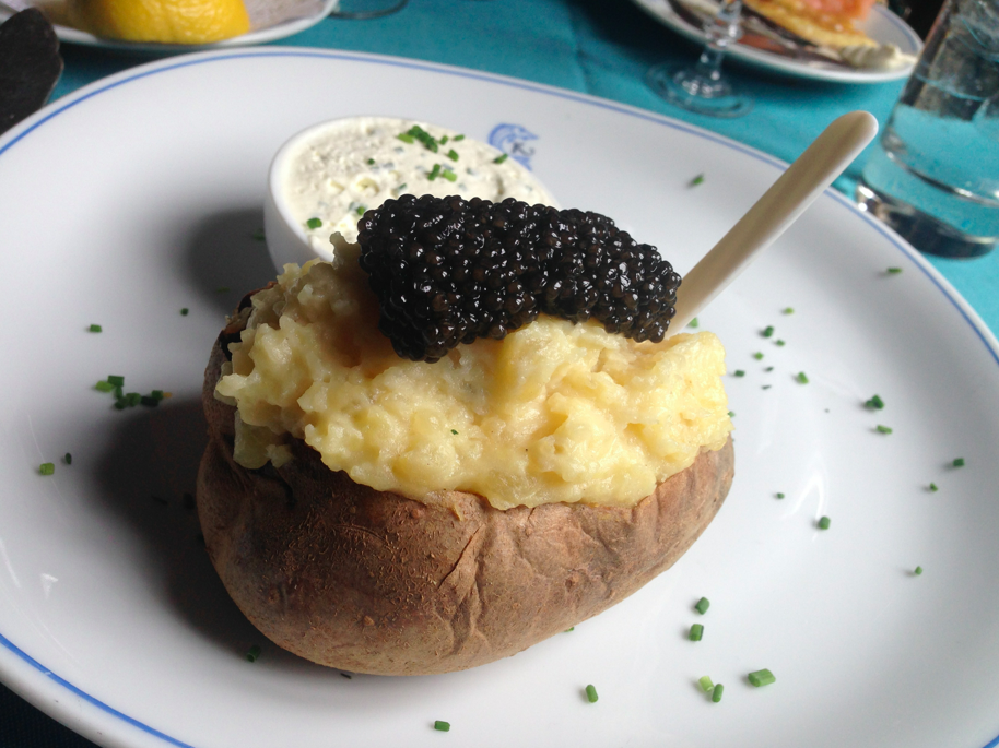 Baked potato (with lots of butter already mixed in) with caviar. Fine dining lunch experience.