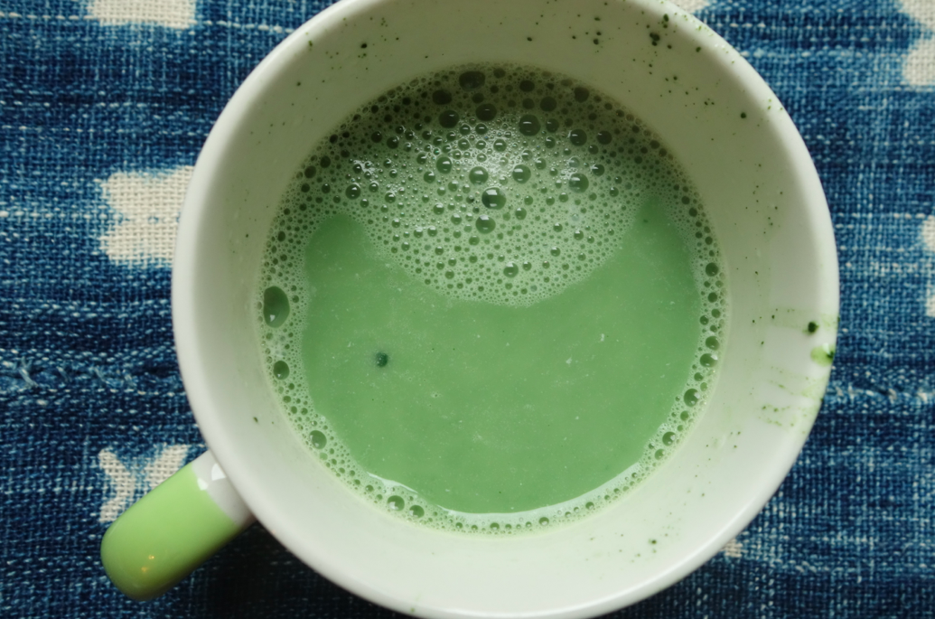 Powdered matcha, hot boiling water, and almond milk!