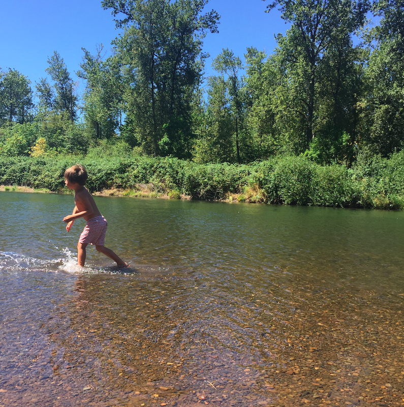 Swims in the river.