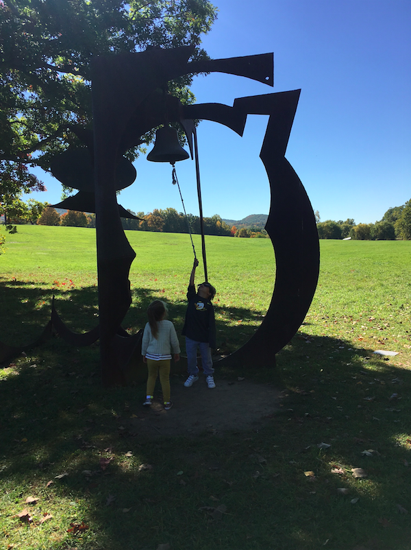 A big bell sculpture.