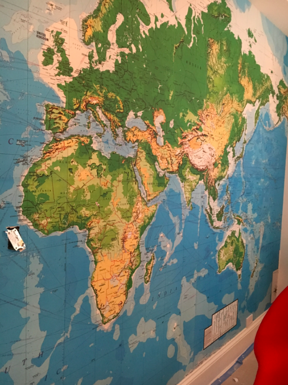 One wall in Cruzzie's room is this whole world map -- it is where eventually his bunkbed will go.